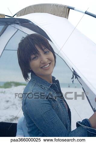 Woman standing in front of tent on beach View Large Photo Image Stock Photography - Woman standing in front of tent on beach. Fotosearch