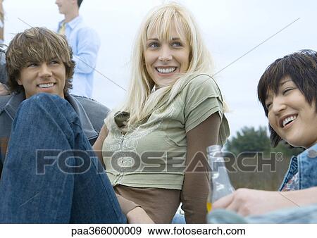 Young adult friends hanging out View Large Photo Image Stock Photo - Young adult friends hanging out. Fotosearch