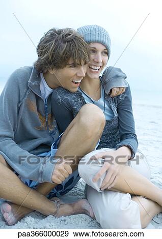Stock Photo - Young couple on beach. Fotosearch