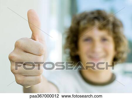 Preteen boy giving thumbs up View Large Photo Image Stock Image - Preteen boy giving thumbs up. Fotosearch