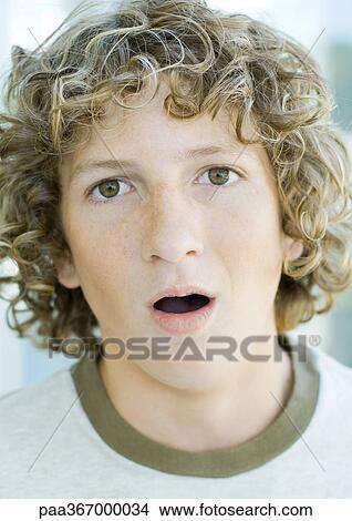 Preteen boy with mouth open, portrait View Large Photo Image Picture - Preteen boy with mouth open, portrait. Fotosearch