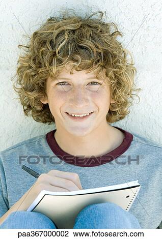 Preteen boy writing, portrait View Large Photo Image Stock Image - Preteen boy writing, portrait. Fotosearch