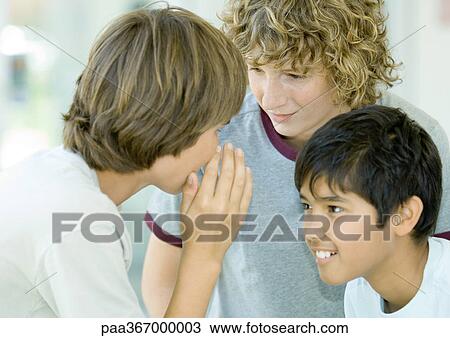 Preteen boys whispering View Large Photo Image Stock Image - Preteen boys whispering. Fotosearch