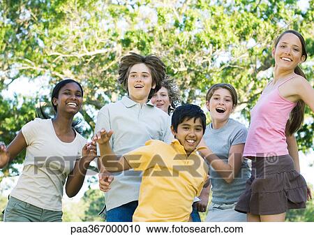 Preteen friends jumping, portrait View Large Photo Image Stock Image - Preteen friends jumping, portrait. Fotosearch