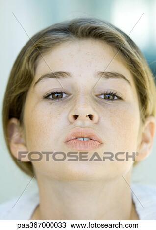 Stock Image - Preteen girl puckering. Fotosearch