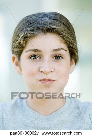 Preteen girl puffing out cheeks View Large Photo Image Stock Photo - Preteen girl puffing out cheeks. Fotosearch