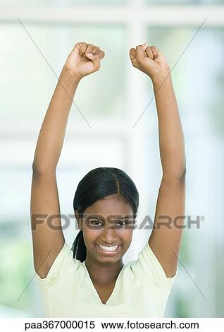 Stock Photography - Teen girl with arms up. Fotosearch