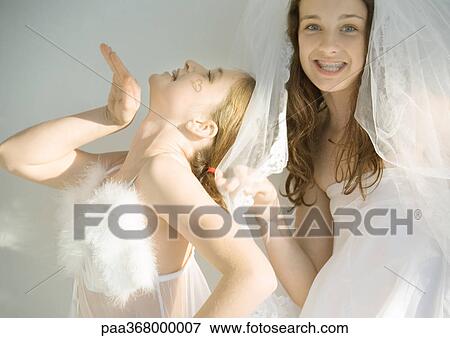 Preteen girls dressed up and playing around View Large Photo Image Stock Photo - Preteen girls dressed up and playing around. Fotosearch