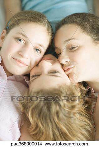 Preteen girls with heads together View Large Photo Image Picture - Preteen girls with heads together. Fotosearch