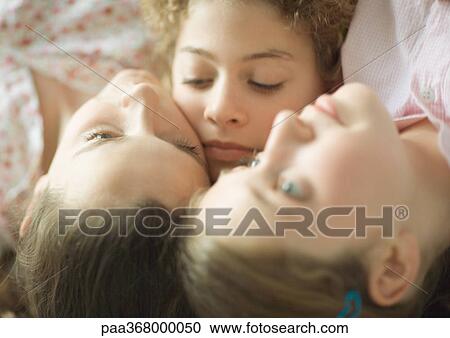 Three preteen girls with heads close together View Large Photo Image Stock Image - Three preteen girls with heads close together. Fotosearch