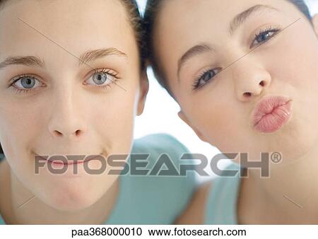 Two preteen girls, one puckering, the other pursing lips View Large Photo Image Stock Image - Two preteen girls, one puckering, the other pursing lips. Fotosearch
