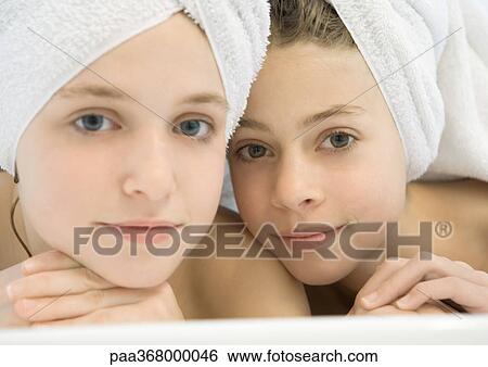 Two preteen girls with hair wrapped in towels View Large Photo Image Stock Photograph - Two preteen girls with hair wrapped in towels. Fotosearch