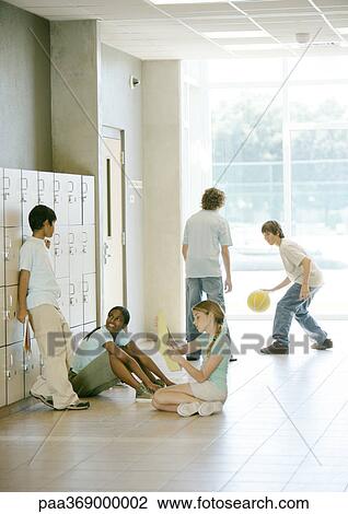 Kids hanging out in hallway of secondary school View Large Photo Image Stock Image - Kids hanging out in hallway of secondary school. Fotosearch
