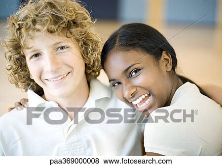 Teenage boy and girl, laughing View Large Photo Image Stock Photo - Teenage boy and girl, laughing. Fotosearch