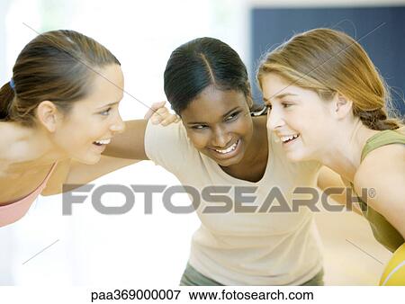 Three teenage girls huddling View Large Photo Image Stock Photo - Three teenage girls huddling. Fotosearch