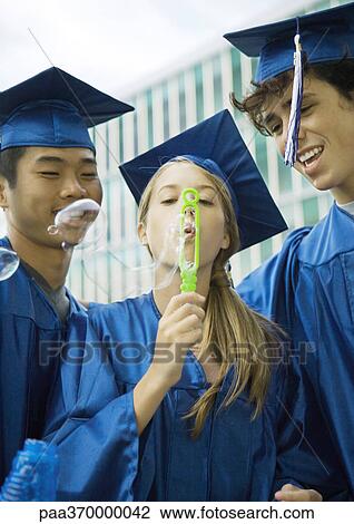 Graduates blowing bubbles View Large Photo Image Stock Image - Graduates blowing bubbles. Fotosearch