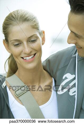 Young couple, man looking at woman, close-up View Large Photo Image Stock Photograph - Young couple, man looking at woman, close-up. Fotosearch