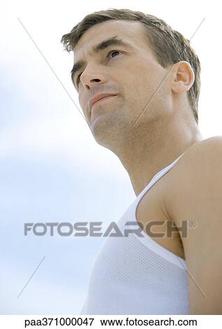 Man looking into distance, low angle view View Large Photo Image Stock Photo - Man looking into distance, low angle view. Fotosearch