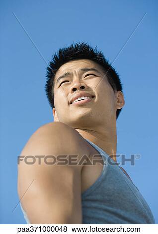 Man looking into distance, low angle view View Large Photo Image Stock Photo - Man looking into distance, low angle view. Fotosearch