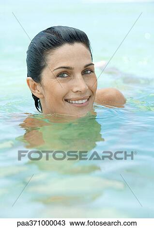 Woman swimming in sea View Large Photo Image Stock Image - Woman swimming in sea. Fotosearch