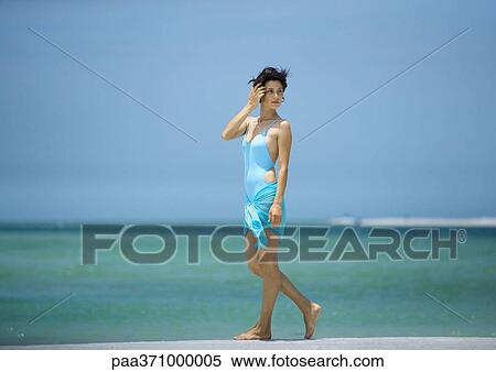 Woman walking on beach View Large Photo Image Stock Photography - Woman walking on beach. Fotosearch
