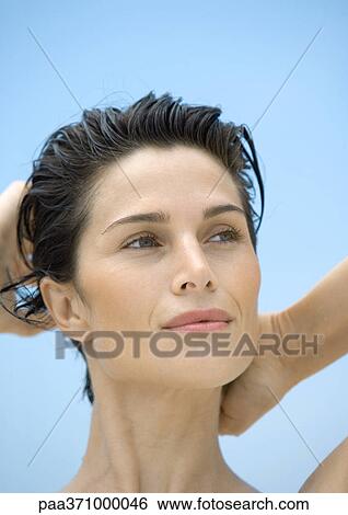 Woman with hands behind head View Large Photo Image Stock Photograph - Woman with hands behind head. Fotosearch
