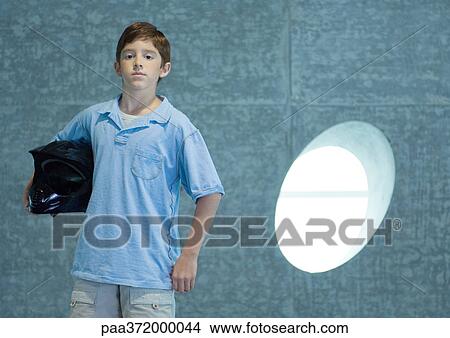 Boy holding helmet under arm View Large Photo Image Picture - Boy holding helmet under arm. Fotosearch