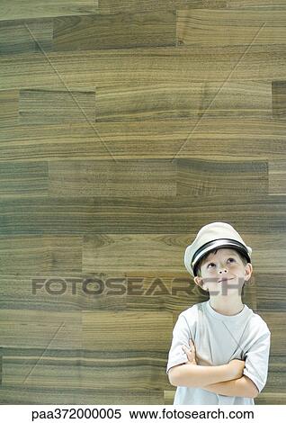 Stock Photography - Boy wearing captain's hat. Fotosearch