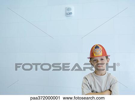 Boy wearing fireman's hat View Large Photo Image Stock Image - Boy wearing fireman's hat. Fotosearch