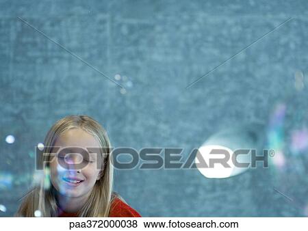 Girl closing eyes as bubbles float in the air View Large Photo Image Stock Photo - Girl closing eyes as bubbles float in the air. Fotosearch
