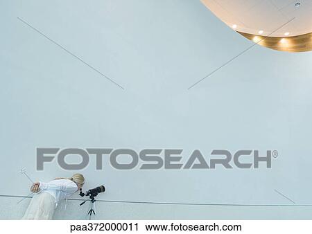 Girl looking through telescope, holding magic wand behind back View Large Photo Image Stock Image - Girl looking through telescope, holding magic wand behind back. Fotosearch