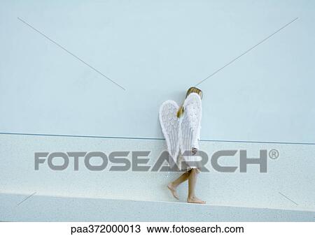 Girl wearing angel wings View Large Photo Image Stock Image - Girl wearing angel wings. Fotosearch