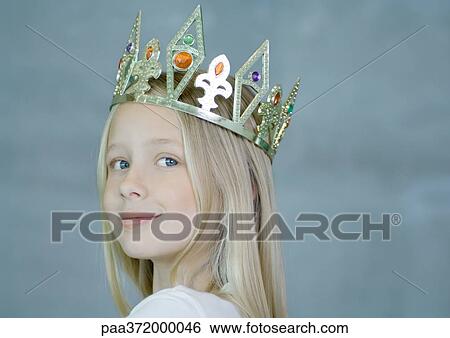 Stock Photograph - Girl wearing crown. Fotosearch