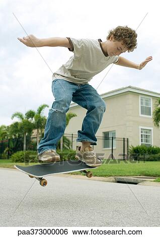 Boy on skateboard View Large Photo Image Stock Photograph - Boy on skateboard. Fotosearch