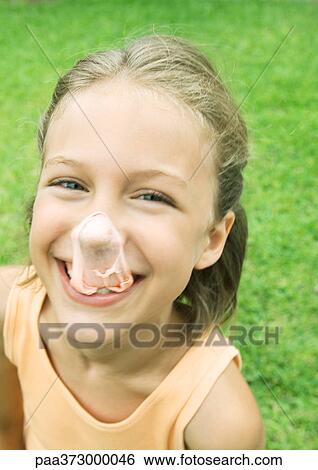 Girl with popped gum bubble on nose View Large Photo Image Stock Photograph - Girl with popped gum bubble on nose. Fotosearch