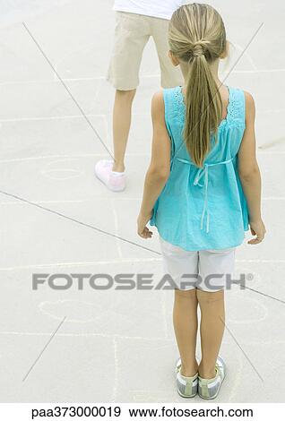 Girls playing hopscotch View Large Photo Image Stock Photo - Girls playing hopscotch. Fotosearch