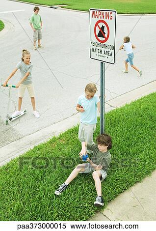Suburban children hanging out in street View Large Photo Image Stock Photography - Suburban children hanging out in street. Fotosearch