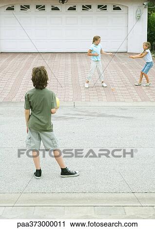 Suburban children playing in driveway View Large Photo Image Stock Image - Suburban children playing in driveway. Fotosearch