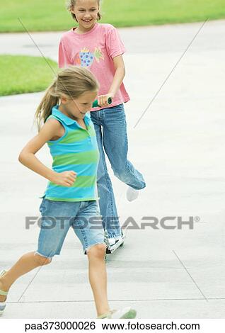 Suburban children playing in driveway View Large Photo Image Stock Photograph - Suburban children playing in driveway. Fotosearch