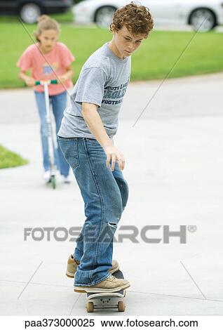 Suburban children playing in driveway View Large Photo Image Stock Photography - Suburban children playing in driveway. Fotosearch