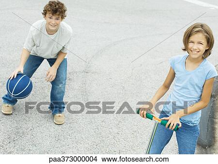 Suburban children playing in street View Large Photo Image Picture - Suburban children playing in street. Fotosearch