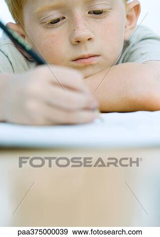 Boy doing homework View Large Photo Image Stock Photo - Boy doing homework. Fotosearch