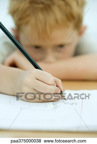 Boy drawing in notebook View Large Photo Image Stock Photo - Boy drawing in notebook. Fotosearch