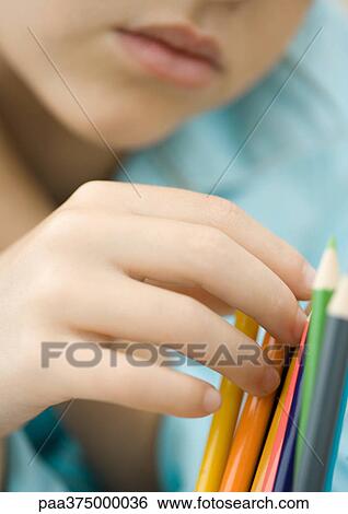 Child touching colored pencils View Large Photo Image Stock Photograph - Child touching colored pencils. Fotosearch