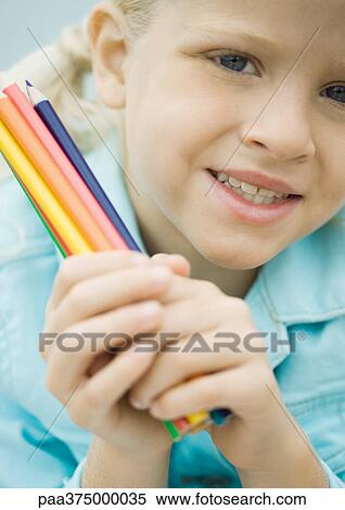 Girl holding colored pencils View Large Photo Image Stock Photography - Girl holding colored pencils. Fotosearch