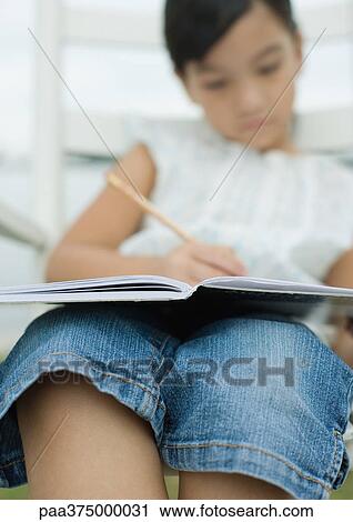 Little girl doing homework View Large Photo Image Stock Image - Little girl doing homework. Fotosearch