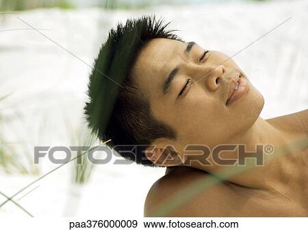 Man leaning head back in sun, eyes closed View Large Photo Image Stock Photo - Man leaning head back in sun, eyes closed. Fotosearch