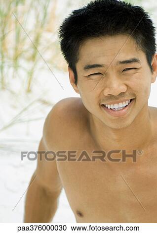 Man on beach, smiling View Large Photo Image Stock Image - Man on beach, smiling. Fotosearch