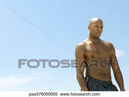 Man standing in sun View Large Photo Image Stock Photography - Man standing in sun. Fotosearch