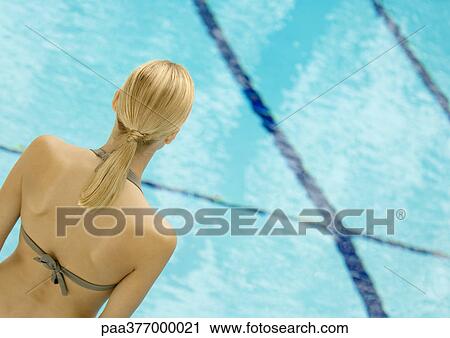 Woman facing pool, rear view View Large Photo Image Stock Image - Woman facing pool, rear view. Fotosearch